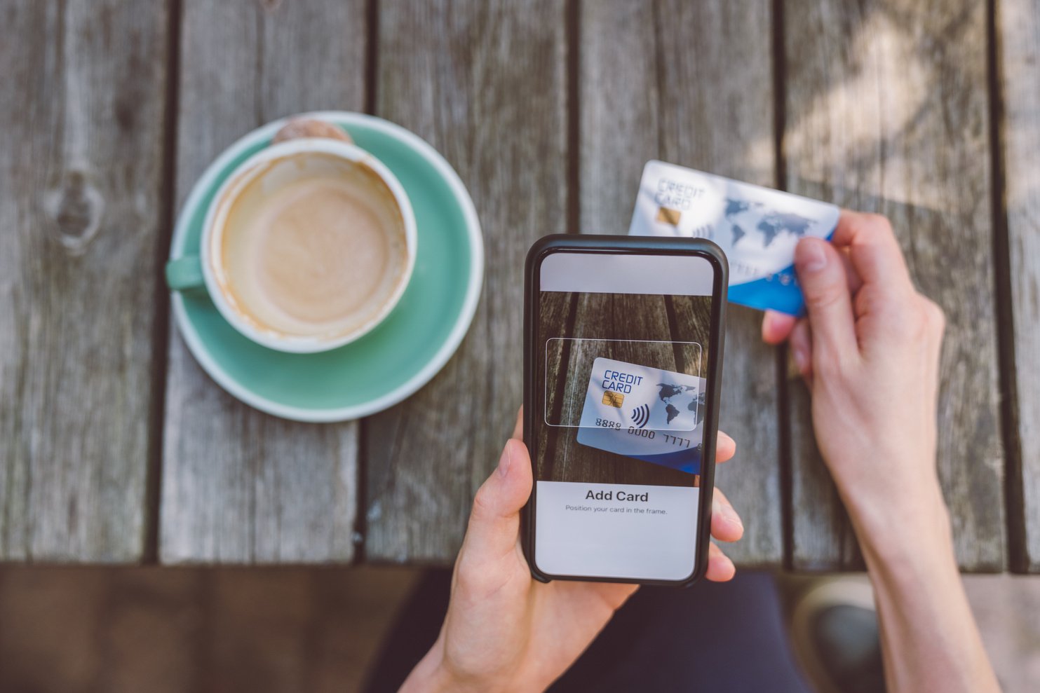 Woman adding credit card into digital wallet