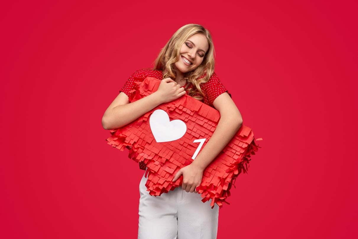 Happy woman embracing banner with social media like sign